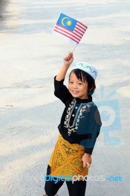 Young Boy Holding Flag Stock Photo