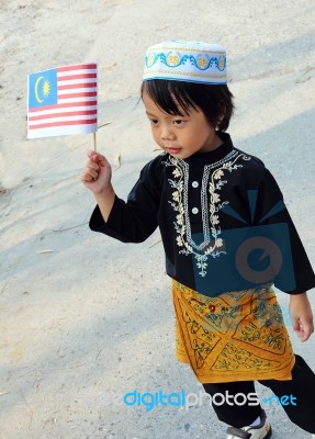 Young Boy Holding Flag Stock Photo