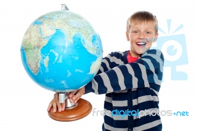 Young Boy Holding Globe Stock Photo