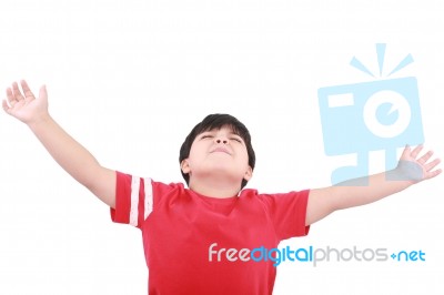 Young Boy Holding Hands Up Stock Photo