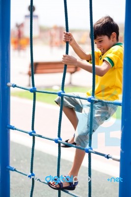 Young Boy On Playstructure Stock Photo