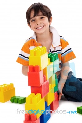 Young Boy Playing With Building Blocks Stock Photo