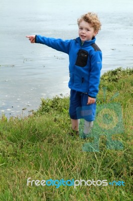 Young Boy Pointing Stock Photo