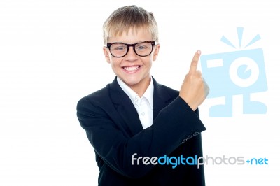 Young boy Pointing Upward Stock Photo