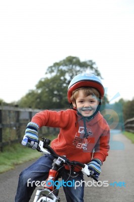 Young Boy Riding A Bike Stock Photo