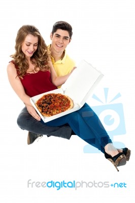 Young Boy Surprises Girlfriend With Pizza Stock Photo