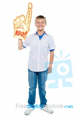 Young Boy Wearing Foam Hand Stock Photo