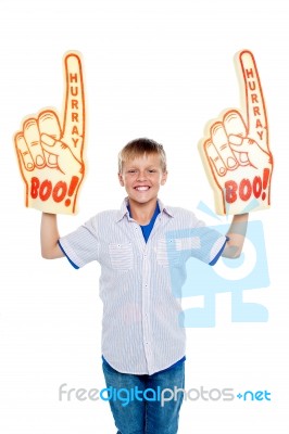 Young Boy Wearing Foam Hand Stock Photo