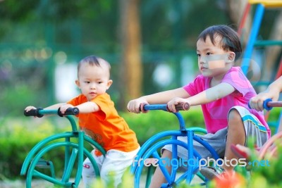 Young Brothers Playing Stock Photo