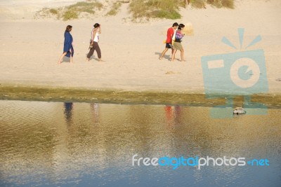 Young Brothers/sisters Walking On Beach Stock Photo