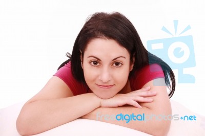 Young Brunette Lying On Bed Stock Photo