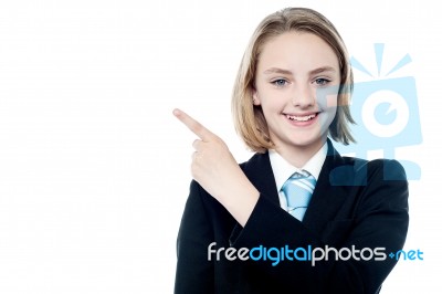 Young Business Girl Pointing Away Stock Photo