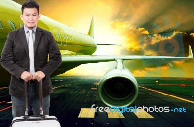 Young Business Man And Traveling Luggage Standing In Front Of Pa… Stock Photo