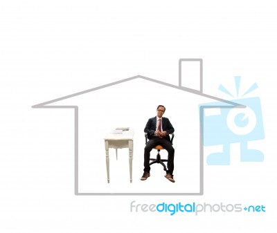 Young Business Man Sitting In Home Outline Stock Photo