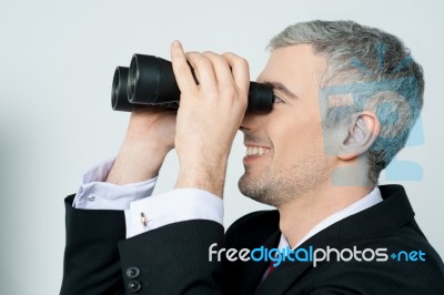 Young Business Man With Binocular Stock Photo