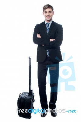 Young Business Man With Trolley Bag Stock Photo