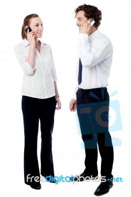 Young Business People Using Cell Phones Stock Photo