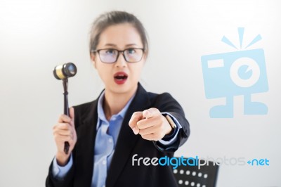 Young Business Woman Raising Her Hand Showing Bidding Gesture Wi… Stock Photo