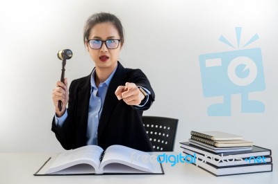 Young Business Woman Raising Her Hand Showing Bidding Gesture Wi… Stock Photo