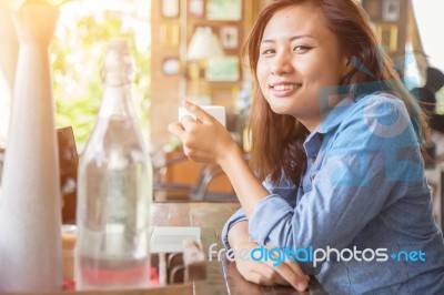 Young Business Woman Sitting In Office Desk Stock Photo