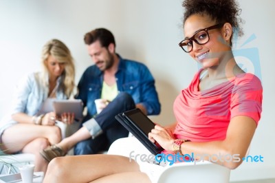 Young Business Woman Using Her Tablet, In The Background The Bus… Stock Photo