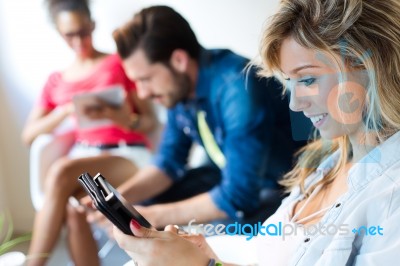 Young Business Woman Using Her Tablet, In The Background The Bus… Stock Photo