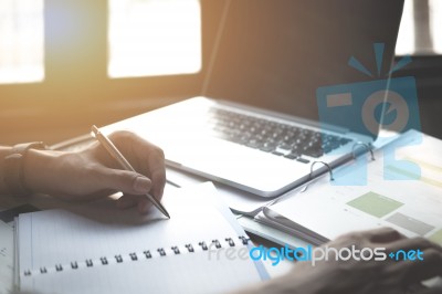 Young Business Woman Working On Laptop Computer Hand Holding Not… Stock Photo