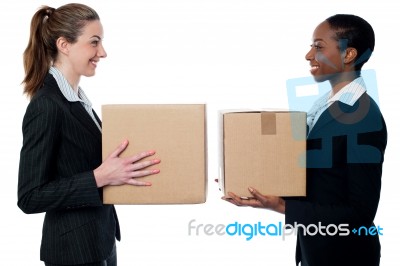 Young Business Womans Holding Small Boxes Stock Photo