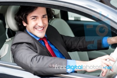 Young Businessman Driving His Car Stock Photo