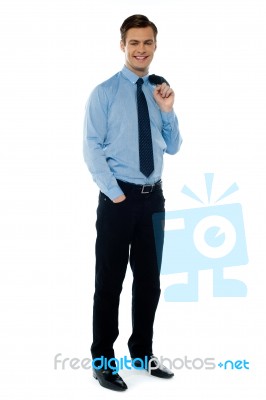 Young Businessman Holding Jacket Stock Photo