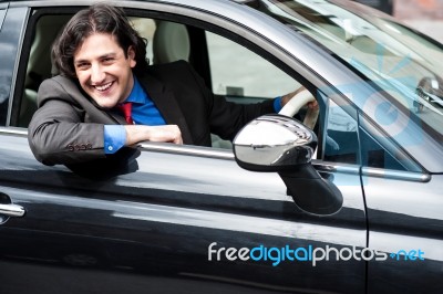 Young Businessman Parking His Car Stock Photo