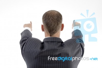 Young Businessman Pointing Back Stock Photo