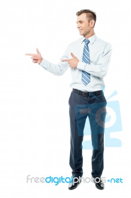 Young Businessman Pointing Copyspace Stock Photo