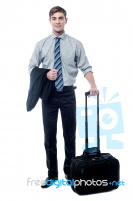 Young Businessman Posing With Trolley Bag Stock Photo