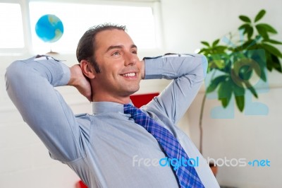 Young Businessman Relaxing And Day Dreaming Stock Photo