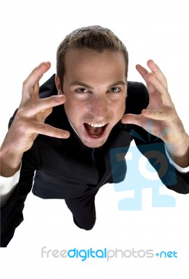 Young Businessman Shouting And Looking Upside Stock Photo