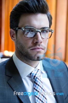 Young Businessman Standing On Office Stock Photo