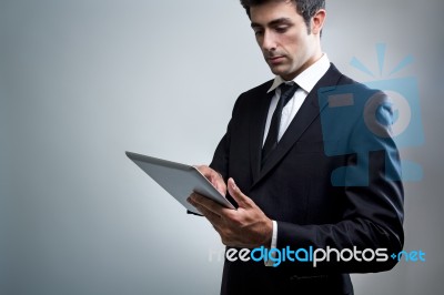 Young Businessman Using Digital Tablet Stock Photo