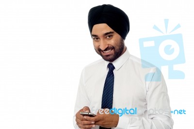 Young Businessman Using Mobile Phone Stock Photo