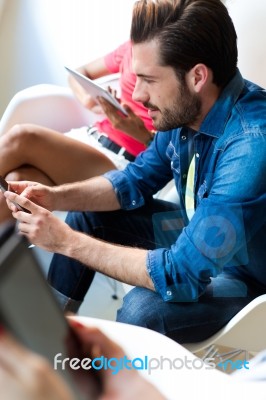 Young Businessman Using The Mobile Phone Stock Photo