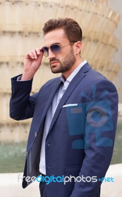 Young Businessmen With Sunglasses Outside Stock Photo