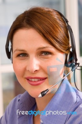 Young Businesswoman With Headset Stock Photo