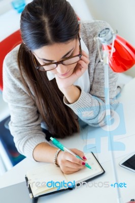 Young Businesswoman Working In Her Office With Laptop Stock Photo