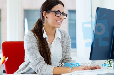 Young Businesswoman Working In Her Office With Laptop Stock Photo