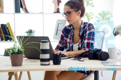 Young Businesswoman Working In Her Office With Laptop Stock Photo