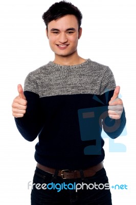 Young Casual Guy Gesturing Double Thumbs Up Stock Photo