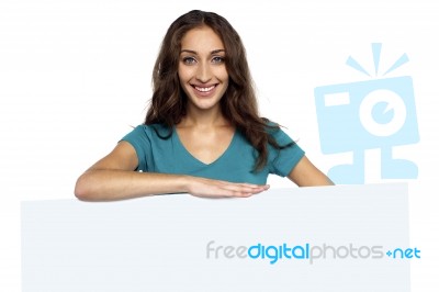 Young Casual Woman Behind Blank Ad Board Stock Photo