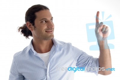 Young Caucasian Man Pointing Upwards Stock Photo