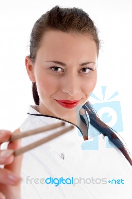 Young Chef Holding Chopsticks Stock Photo