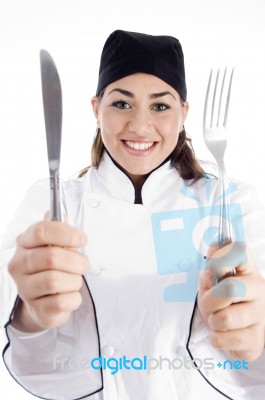 Young Chef Holding Cutlery Stock Photo